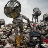 Trash pickers search for recyclable plastic and other items of value at a landfill in Bantar Gebang, Indonesia, in February 2020.  | ADAM DEAN / THE NEW YORK TIMES