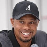Tiger Woods announced on Tuesday that he is recovering at home after being released from the hospital. Woods suffered severe leg injuries in a car accident last month. | AFP-JIJI