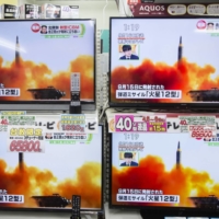 Televisions at an electronics store in Tokyo in November 2017 display a news report on North Korea\'s launch of the Hwasong-12 missile in September 2017. | BLOOMBERG