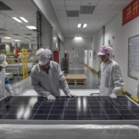 A solar-panel production line at a plant in Suzhou, China.  | GILLES SABRIE / THE NEW YORK TIMES