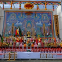 The elaborately decorated altar includes a large Mandala tapestry from Bhutan.