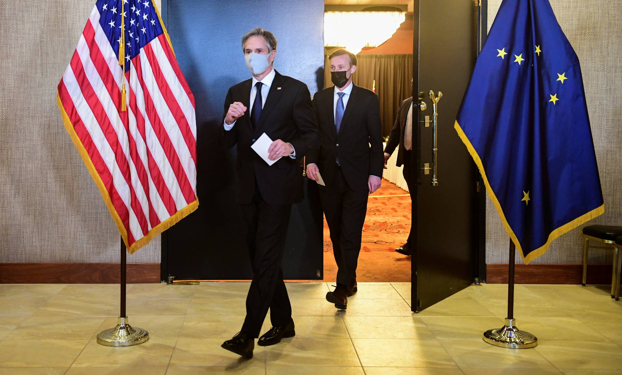 U.S. Secretary of State Antony Blinken and National Security Advisor Jake Sullivan exit from closed-door talks between the United States and China upon conclusion of a two-day meeting in Anchorage, Alaska, on Friday.   | POOL / VIA REUTERS