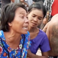 People mourn during the funeral for Tun Tun Aung, a 15-year-old, who was killed in his hut when security forces opened fire, in Mandalay, Myanmar, on Monday.  | RADIO FREE ASIA / VIA REUTERS 