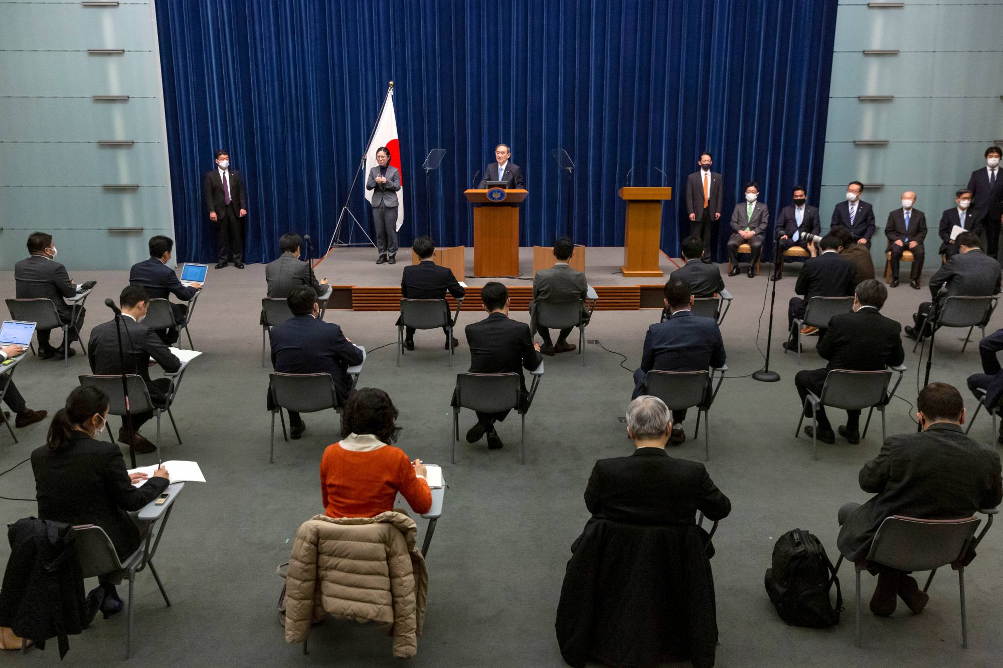 Members of the media attend a news conference held by Prime Minister Yoshihide Suga in Tokyo on March 5. | Pool /via REUTERS