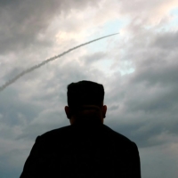North Korean leader Kim Jong Un watches the launch of a ballistic missile at an unknown location in this screenshot taken from state media on July 31, 2019. | KCTV / VIA AFP-JIJI