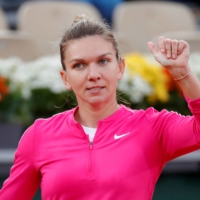 Simona Halep celebrates after winning her second-round match against Irina-Camelia Begu during the French Open in Paris on Sept. 30, 2020. | REUTERS
