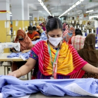 A woman works in a garment factory in Dhaka in May last year.  | REUTERS
