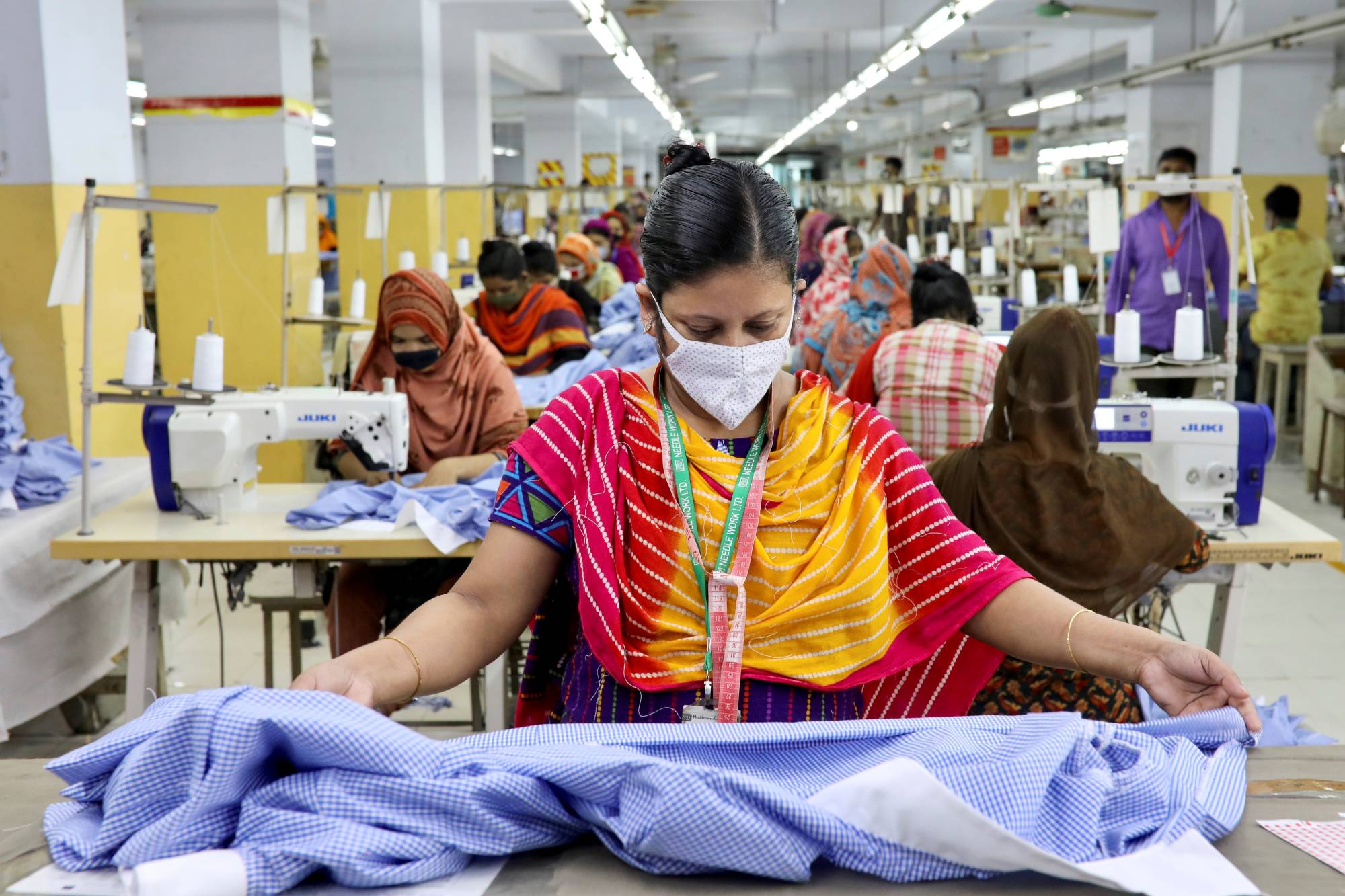 A woman works in a garment factory in Dhaka in May last year. | Reuters