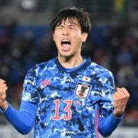 Miki Yamane celebrates after scoring Japan\'s first goal against South Korea on Thursday in Yokohama. | AFP-JIJI