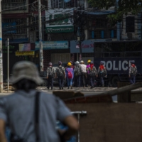 Police take arrested protesters to a prison truck in Yangon, Myanmar, on March 3.  | THE NEW YORK TIMES