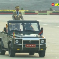 Myanmar armed forces chief Senior Gen. Min Aung Hlaing rides in car during an annual parade put on by the military to mark Armed Forced Day in the capital, Naypyidaw, in a screenshot taken from Myawaddy TV on Saturday.  | MYAWADDY TV / VIA AFP-JIJI