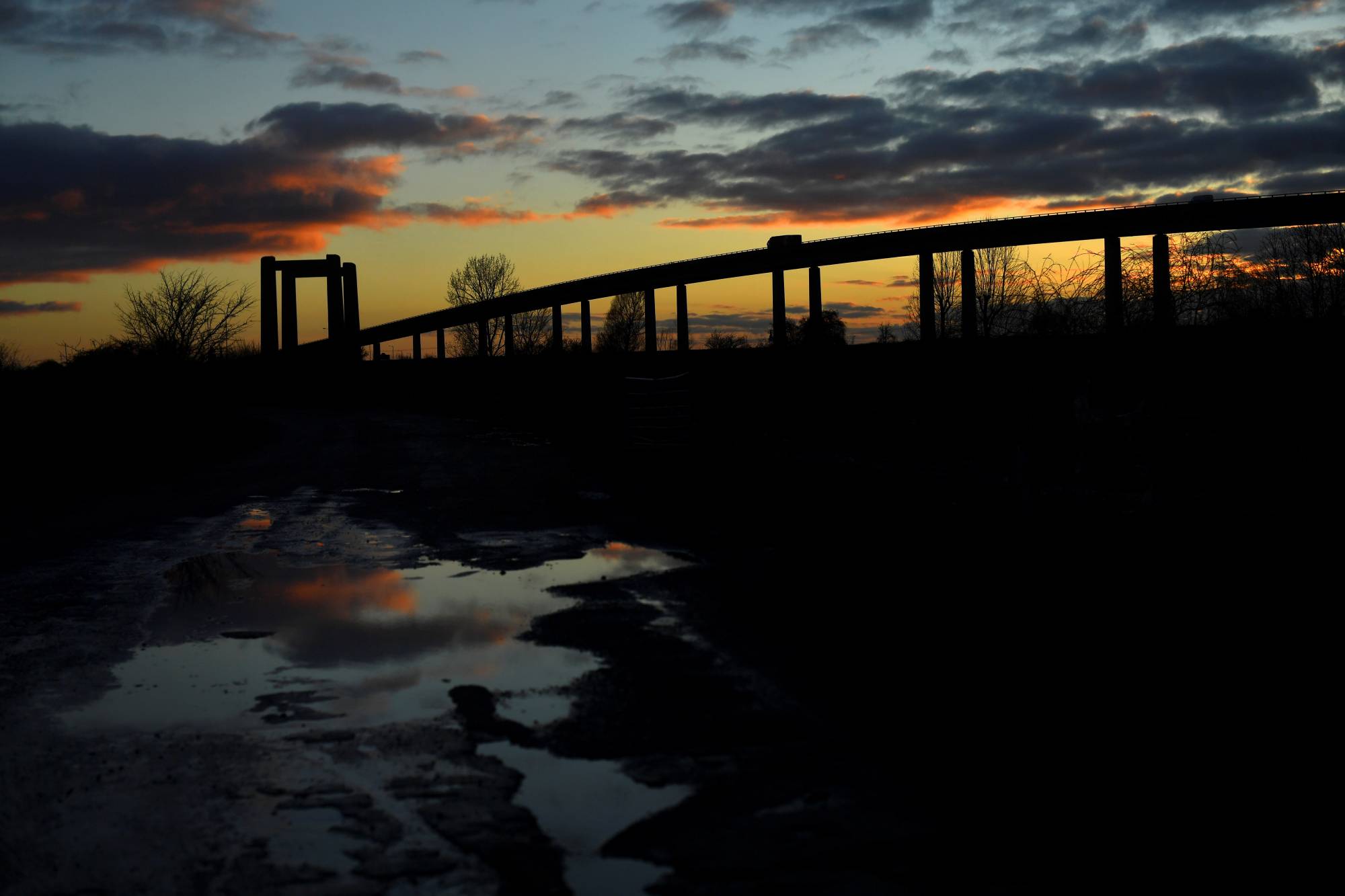 The sun sets on Kingsferry Bridge as seen from Sheerness, on the Isle of Sheppey, England. | REUTERS