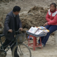 A vendor sells pirated DVDs in Hefei, Anhui province, China, in November 2007. | REUTERS 