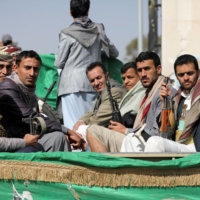 Armed Houthi followers depart after a funeral in Sanaa, Yemen, on Feb. 20 for fellow fighters killed in recent fighting against government forces in Yemen\'s oil-rich province of Marib. | REUTERS 