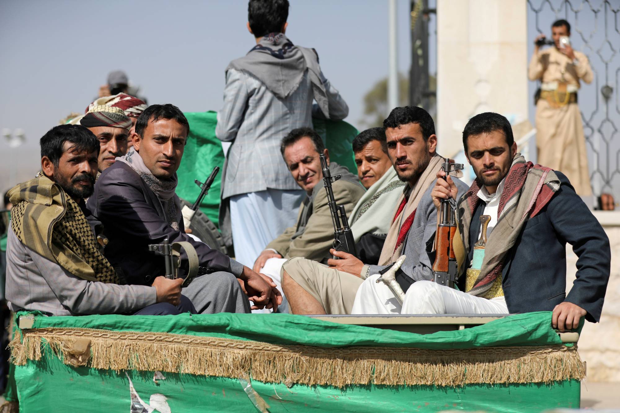 Armed Houthi followers depart after a funeral in Sanaa, Yemen, on Feb. 20 for fellow fighters killed in recent fighting against government forces in Yemen's oil-rich province of Marib. | Reuters 