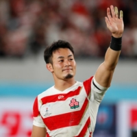 Kenki Fukuoka waves to the crowd following Japan\'s quarterfinal match against South Africa during the Rugby World Cup on Oct. 20, 2019, in Tokyo. | REUTERS