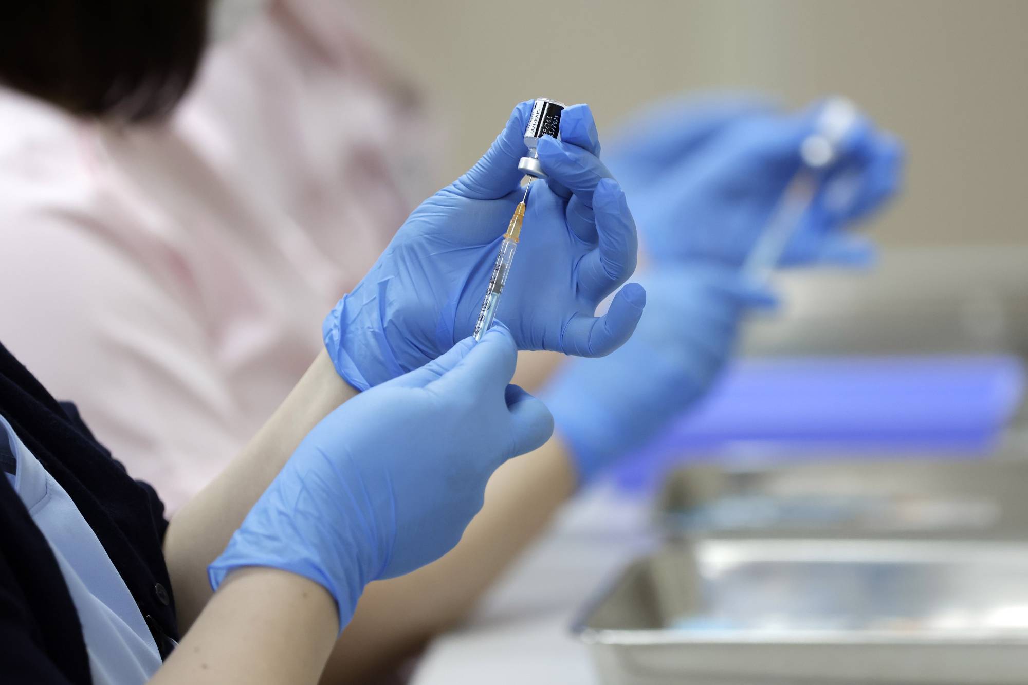 The health ministry has released in 12 languages basic information on the COVID-19 vaccination, including who can get inoculated, the possible side effects and how a person can get the shot. | BLOOMBERG