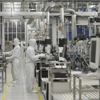 Employees works at Renesas Electronics Naka wafer fabrication factory in Hitachinaka, Ibaraki Prefecture, in June 2011. | AFP-JIJI