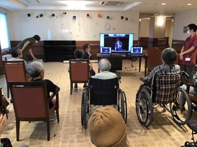 With many recreational activities canceled during the pandemic, nursing care provider Sompo Care Inc., hosts daily events streamed live on large television screens installed in its nursing facilities. | Courtesy of Sompo Care Inc. 