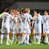 Samurai Blue players celebrate after their 14-0 win over Mongolia on Tuesday. | AFP-JIJI