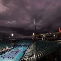 The court at Grandstand Stadium is dried during a rain delay during the Miami Open on April 1. | USA TODAY / VIA REUTERS