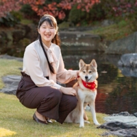 Princess Aiko, daughter of Emperor Naruhito and Empress Masako, poses for a photograph with her pet dog Yuri at the Akasaka Estate residence in Tokyo, in November.  | IMPERIAL HOUSEHOLD AGENCY / VIA REUTERS 
