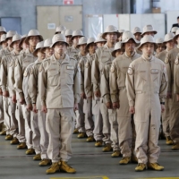 Maritime Self-Defense Force personnel attend a ceremony in January 2020 before departing for Djibouti for the SDF\'s first long-term intelligence-gathering mission abroad. | KYODO
