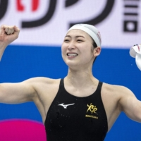 Rikako Ikee reacts after winning the 100-meter butterfly final during the national championships on Sunday. | AFP-JIJI