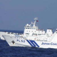 Japan Coast Guard vessels have repeatedly clashed with or chased off Chinese vessels from the waters around the Senkaku Islands in recent years. | JAPAN COAST GUARD / VIA REUTERS