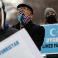 A man chants with others during a rally against China\'s treatment of its Uyghur population and Muslim minorities, in Washington in February. | REUTERS