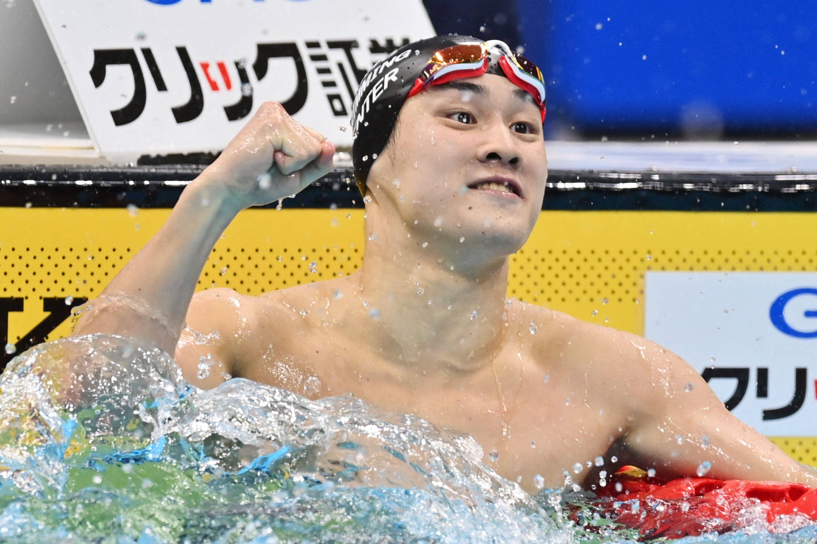 Shoma Sato celebrates after winning the men's 200-meter breaststroke final at the national swimming championships at the Tokyo Aquatics Centre on Wednesday. | AFP-JIJI