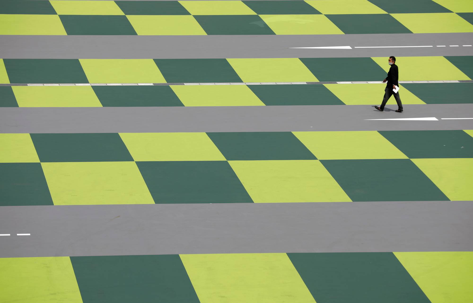 A man walks through a shopping mall in Tokyo on Thursday. | REUTERS