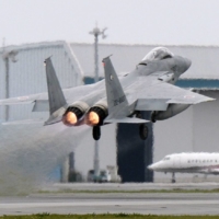 An F-15 fighter jet takes off from an Air Self-Defense Force base in Naha in April 2015. | KYODO