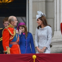 Queen Elizabeth looks on as her husband speaks with Prince William and Catherine, Duchess of Cambridge following the Trooping the Colour ceremony in central London in June 2012. | REUTERS
