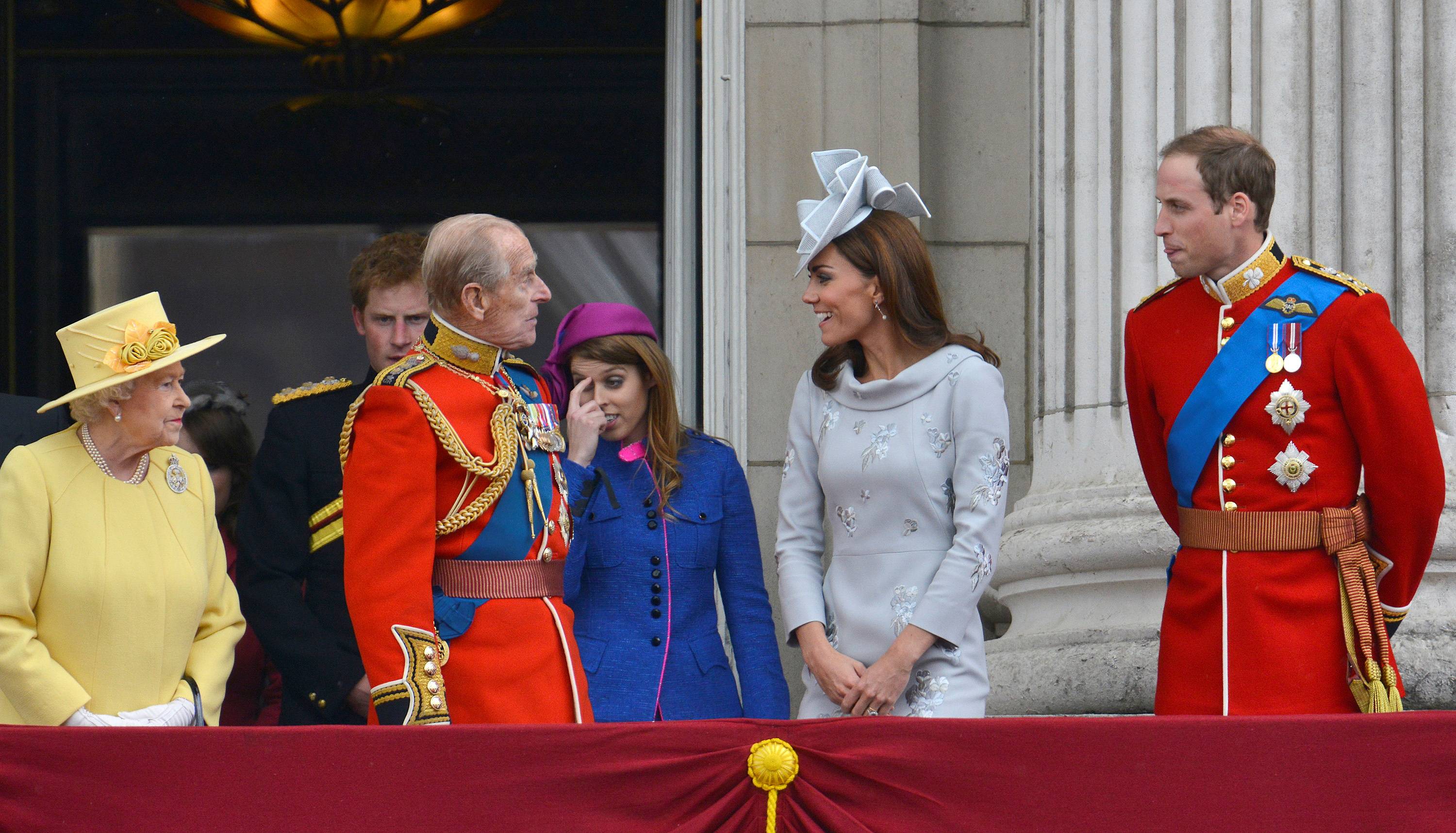 Queen Elizabeth looks on as her husband speaks with Prince William and Catherine, Duchess of Cambridge following the Trooping the Colour ceremony in central London in June 2012. | REUTERS