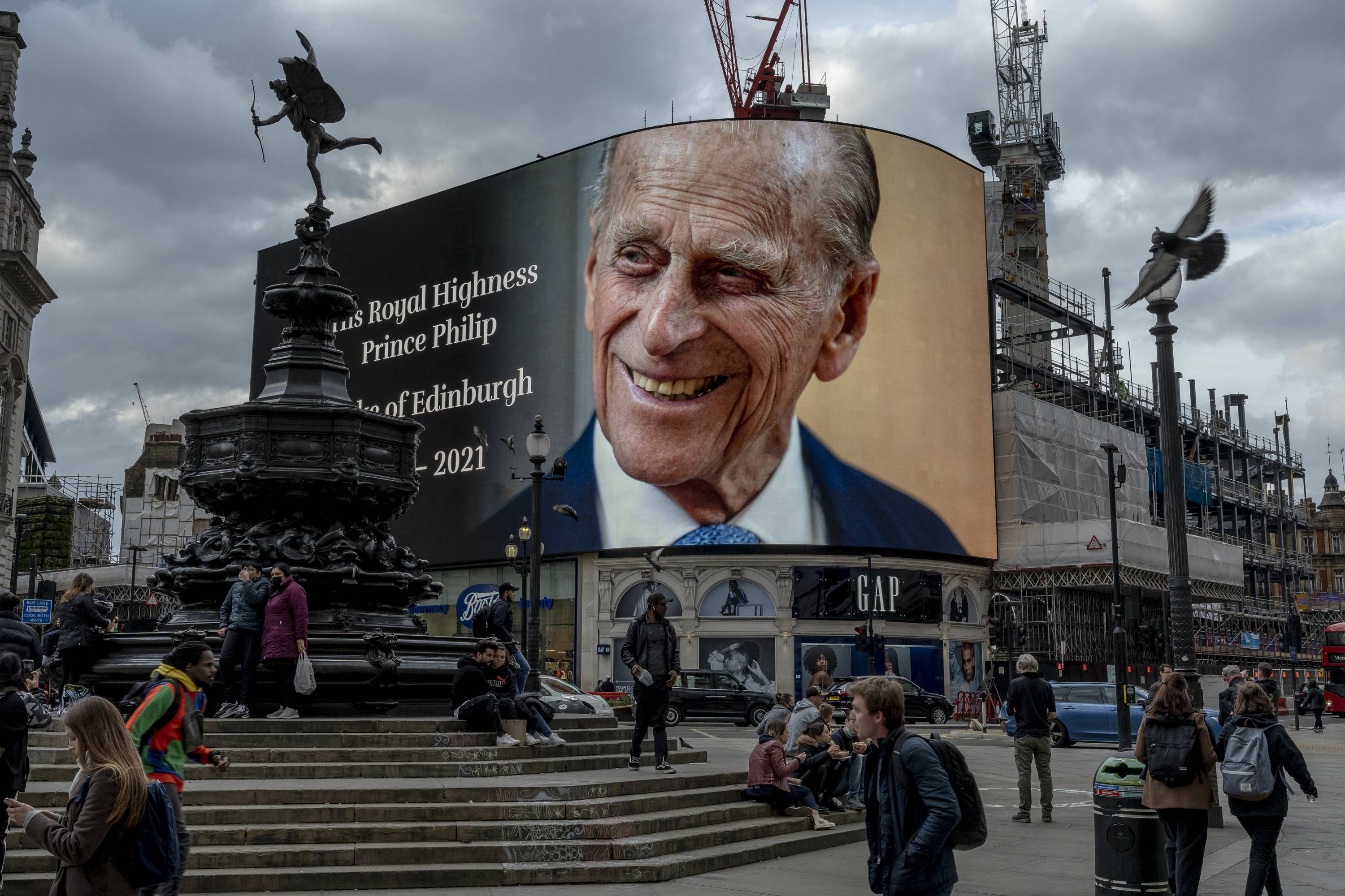 A photo of Prince Philip dominates Picadilly Circus in London on Friday, after his death was announced earlier in the day. | ANDREW TESTA / THE NEW YORK TIMES