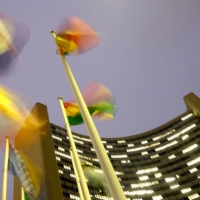 Flags flutter in the wind in front of the headquarters of the International Atomic Energy Agency in Vienna last December. | REUTERS