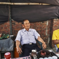 Rice farmers Huang Shui-ho (left) and Yang Kuei-chuan in Tainan, Taiwan.  | AN RONG XU / THE NEW YORK TIMES
