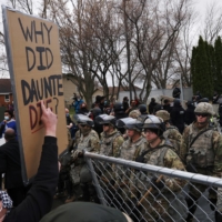 Protesters rally outside Brooklyn Center Police Department on Monday, a day after Daunte Wright was shot and killed by a police officer, in Brooklyn Center, Minnesota. | REUTERS
