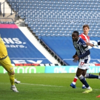 West Bromwich Albion striker Mbaye Diagne (center) saw an early header against Southampton on Sunday called off after VAR found him offside. | POOL / AFP-JIJI