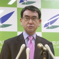 Vaccine rollout minister Taro Kono warns against wasting COVID-19 vaccine shots during a news conference on Tuesday. | KYODO