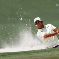 Hideki Matsuyama plays out of a bunker on the second hole during Sunday\'s final round at Augusta National. | REUTERS
