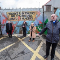 Church leaders from both communities gather at the peace wall in West Belfast, Northern Ireland, on April 9. They called for the recent nightly violence in Belfast to stop. | AFP-JIJI