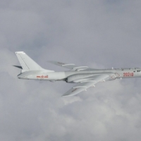 A Chinese H-6 bomber flies over East China Sea in July 2019. The Chinese military has ramped up its activities in the waterway as its capabilties grow more powerful. | JOINT STAFF OFFICE OF THE DEFENSE MINISTRY OF JAPAN / VIA REUTERS