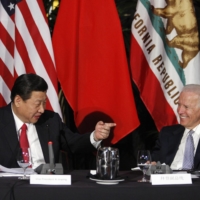 Xi Jinping, China\'s vice president at the time, speaks during a meeting with former U.S. Vice President Joe Biden in Los Angeles in February 2012. When Biden meets Prime Minister Yoshihide Suga later this week, China is expected to be the top issue of their discussions. | REUTERS