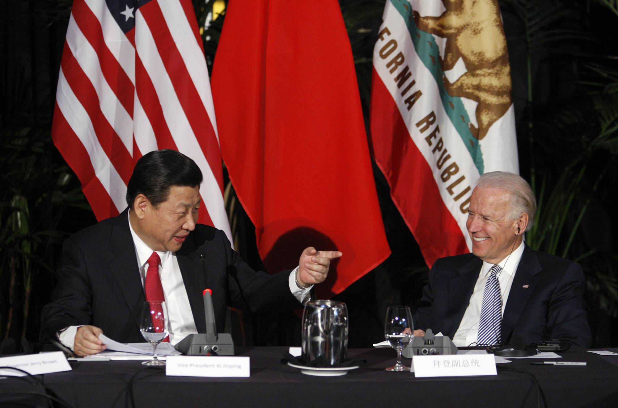 Xi Jinping, China's vice president at the time, speaks during a meeting with former U.S. Vice President Joe Biden in Los Angeles in February 2012. When Biden meets Prime Minister Yoshihide Suga later this week, China is expected to be the top issue of their discussions. | REUTERS