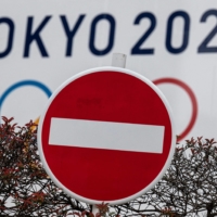 While Olympics organizers announced in March that fans from overseas would be banned from attending, the debate over the degree to which domestic spectators will be capped continues to be divisive. | AFP-JIJI