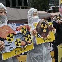 South Korean environmental activists protest against Japan\'s decision on releasing Fukushima wastewater, near the Japanese Embassy in Seoul on Tuesday.  | AFP-JIJI