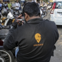 SoftBank Group Corp. is investing in Indian food delivery startup Swiggy as global investors see growing opportunity in the country’s startup scene. | BLOOMBERG