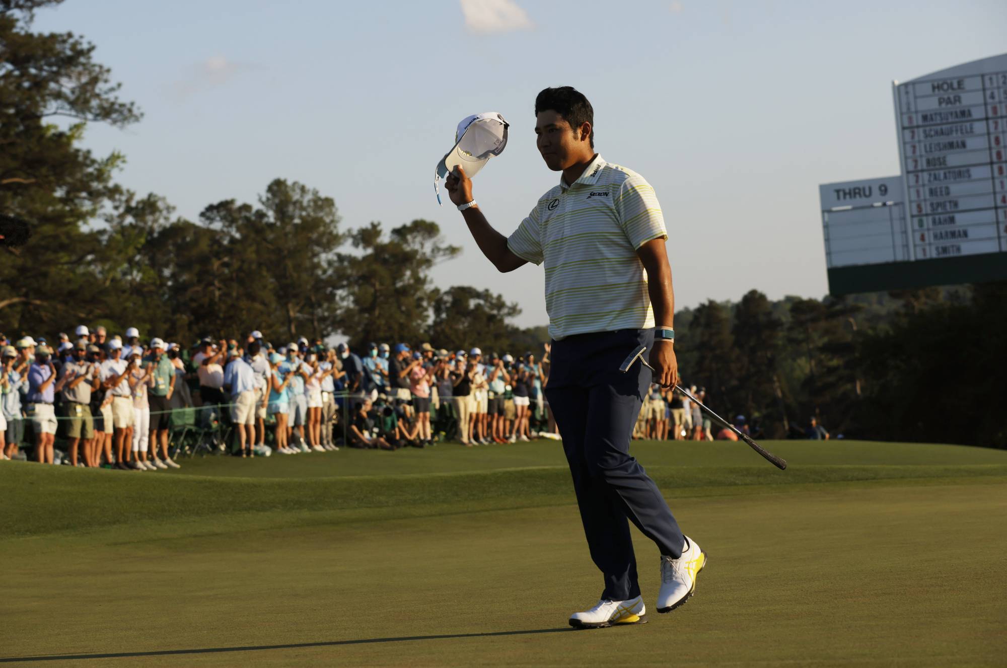 Hideki Matsuyama celebrates on the 18th green after winning the Masters in Augusta, Georgia, on April 11. | REUTERS